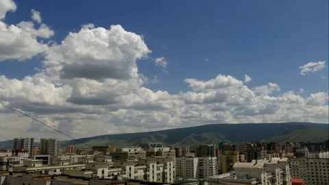 Picturesque flying clouds over the city, time lapse. Stock Footage 89675433