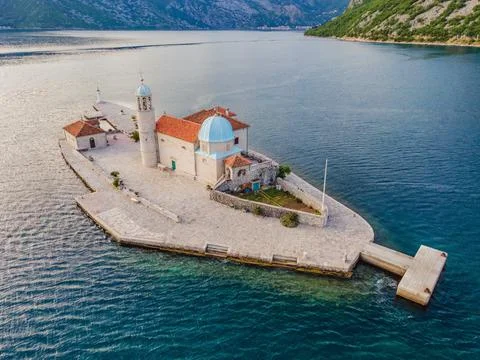 Picturesque island st. George and temple Gospa od Skrpela. Drone view. Boka Stock Photos