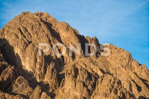 The picturesque mountain on the background of a blue sky Stock Photos