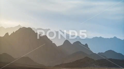 The picturesque mountain on the background of foggy sky Stock Photos