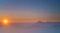 The picturesque mountain fog on the background of sunset. Wide angle Photo