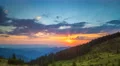 The picturesque mountain hill on the background of sunset. Time lapse 4k or 4k+ Resolution
