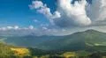 The picturesque mountain view on the background of cloud stream. Wide angle Photo