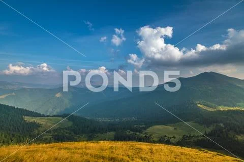 The picturesque mountain view on the background of cloud stream. Wide angle Stock Photos