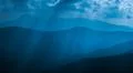 The picturesque mountain view on the background of moonlight. Wide angle Photo