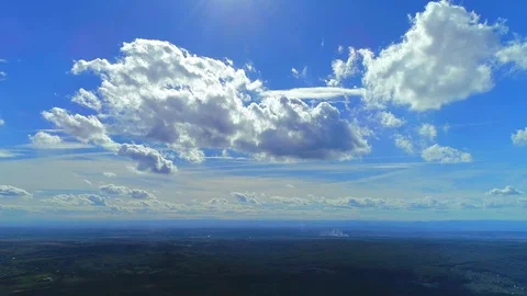 Picturesque panorama of dense fluffy clouds softly lit by the sun. 4K Stock Footage 116888435