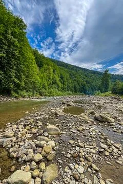 The picturesque Prut River flows through scenic Carpathian landscapes Stock Photos