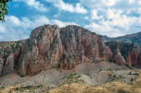Picturesque red cliffs in front of the monastery complex Navorank. Stock Photos