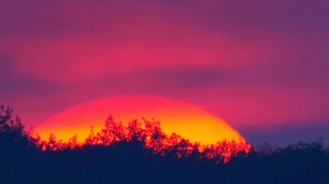 Picturesque red sunset with bright clouds, close up zoom view. BIRDS are seen Stock Footage 53001785