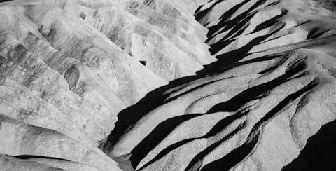 Picturesque soft waves from multi-coloured sandstone. Death valley, Zabriski Stock Photos