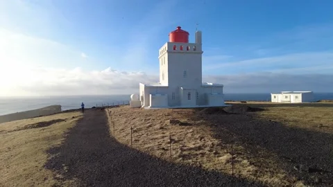Picturesque spring evening view to Dyrholaey lighthouse and Reynisfjara Stock Footage 172364295