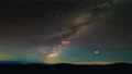 The picturesque starry sky above mountains. time lapse 4k or 4k+ Resolution