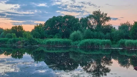 Picturesque summer nature. Clouds quickly swim around sky. Slow beautiful riv Stock Footage 201012497