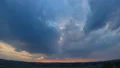 The picturesque sunset on the cloudy background, time lapse 4k or 4k+ Resolution