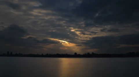 The picturesque sunset with puffy clouds above land with lake. Time lapse Stock-Footage 48267634