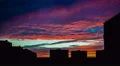 The picturesque sunset (sunrise) with beautiful clouds by city buildings 4k or 4k+ Resolution