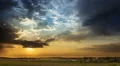 The picturesque sunset (sunrise) with rainy clouds, wide angle view 4k or 4k+ Resolution