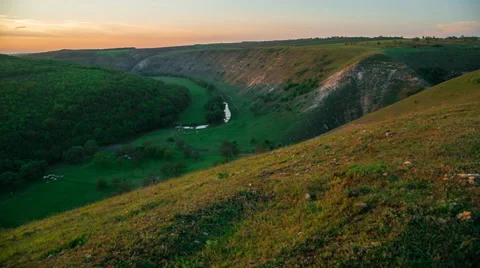 Picturesque sunset in a valley with a river Stockbeeldmateriaal 37812969