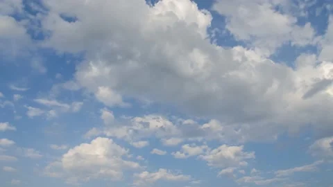 Picturesque timelapse of white fluffy clouds moving softly on the clear blue sky Stock Footage 170450114