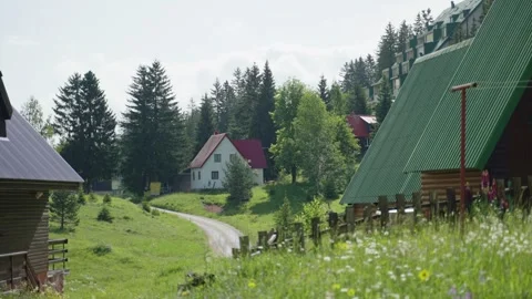 Picturesque view during springtime in the Balkans with small houses and cabins Stock Footage 284385826