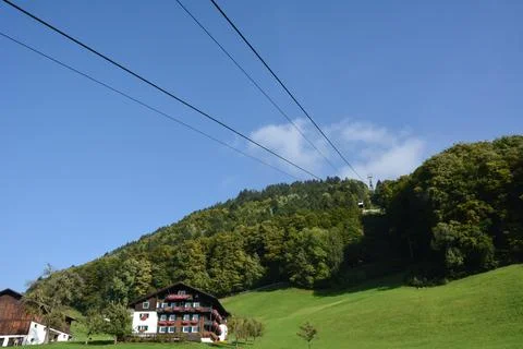 A picturesque view of the hotel under the forested mountain Stock Photos