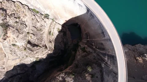 Picturesque view of river between rocky cliffs near arch dam Stock Footage 260411976