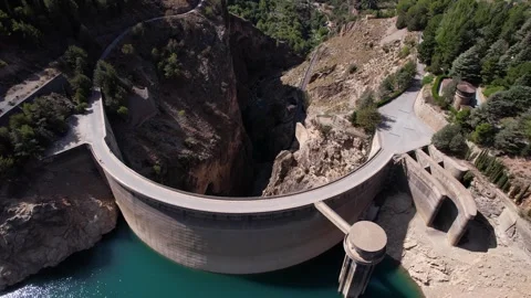 Picturesque view of river between rocky cliffs near arch dam Stock Footage 260412208