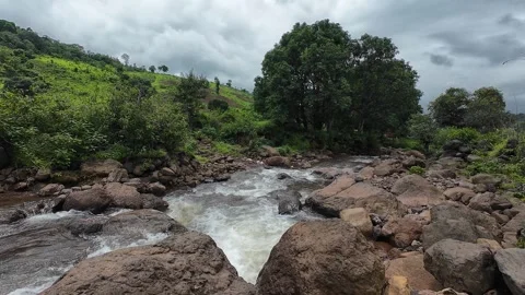 A picturesque view of a stream winding over rocks Stock Footage 288844495