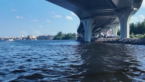 Picturesque view under the bridge on the Neva River with boats Stock Footage 313809056