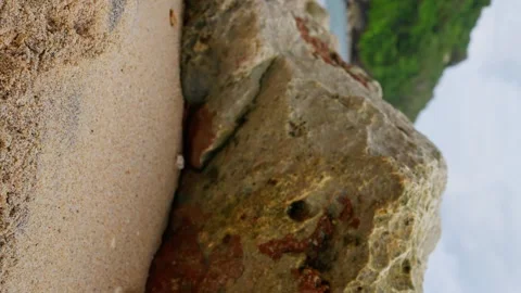 Picturesque view of the wavy ocean on a sandy beach. Slow motion, Vertical video Stock Footage 245087914