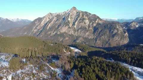 Picturesque views of the mountain landscape with dense coniferous forests and sn Stock Footage 303636638