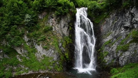 Picturesque waterfall in the mountains. (Sauth deth Pish) Stock Footage 167904345