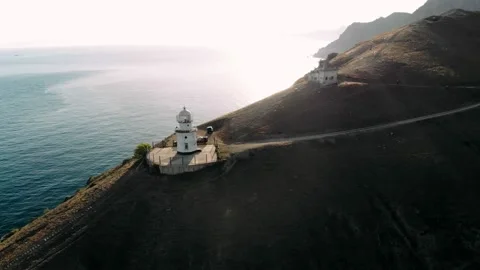 Picturesque white lighthouse at the sunset. Stock Footage 162976885