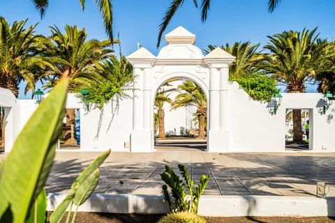 Picturesque whitewashed architecture with green elements in Costa Teguise, .. Stock Photos