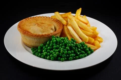 Pie and chips with peas. Stock Photos