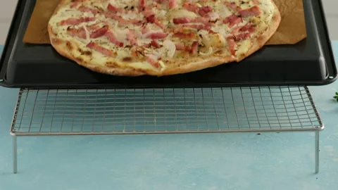 Pie with bacon, onion and sour cream. Flammkuchen. The woman made a German pie Stock Footage 138930060