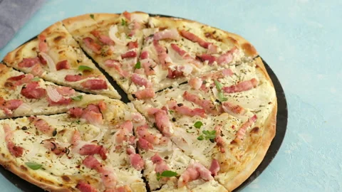Pie with bacon, onion and sour cream. Flammkuchen. The woman made a German pie Stock Footage 138931782