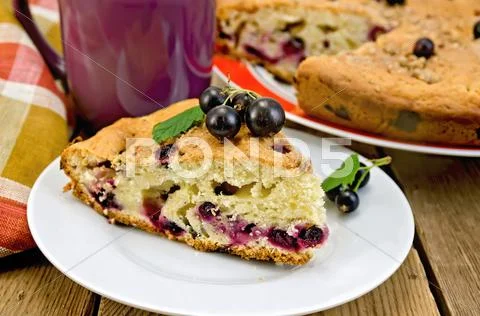 Pie with black currant on the board Stock Photos