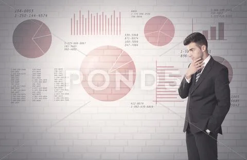 Pie charts and numbers on wall with salesman Stock Photos