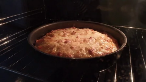 The pie is cooked in the oven. Homemade baking. Cooking Stock Footage 125529606