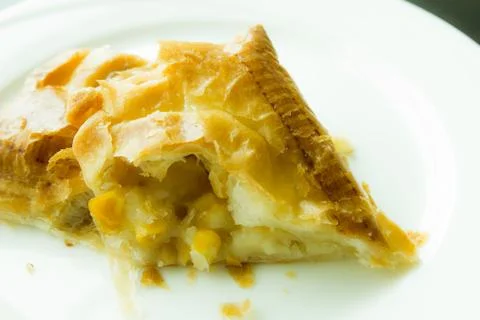 Pie corn on white plate Stock Photos