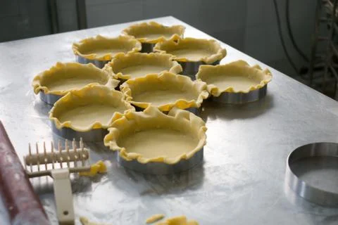 Pie Crusts on Stainless Prep Table Stock Photos