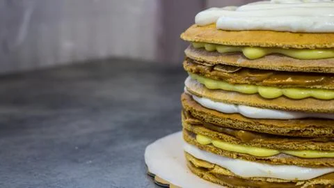 Pie with different types of cream, in the process Stock Photos