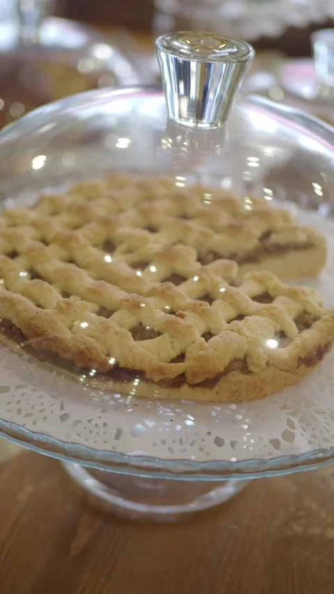 Pie on display in a cafe with glass cover 스톡 동영상 335975112