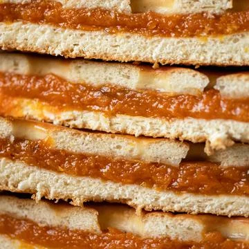 Pie with dried apricots filling. Stack of pie slices stuffed with dried apricots Stock Photos