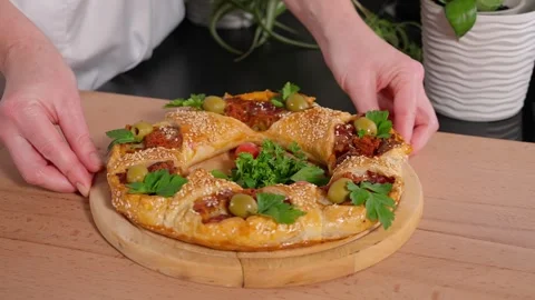 Pie filled with potatoes and bacon on a wooden round board. Stock Footage 264141792