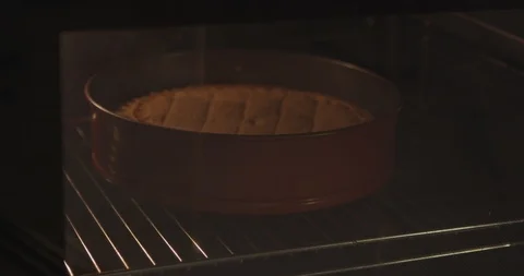 Pie inside the oven through the glass Stock Footage 122271708