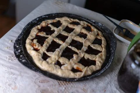 Pie with jam on a baking sheet before baking Stock Photos