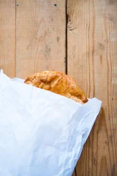 Pie or some cookie in white pack on the wooden background Stock Photos