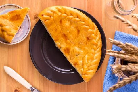 Pie on a plate on the table. Breakfast or lunch. Food photo. Stock Photos